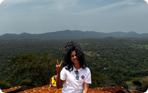 Nakshatra outdoors against a hilly landscape